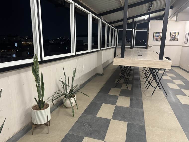 The business centre mid-floor, framed prints along the wall and the city outside